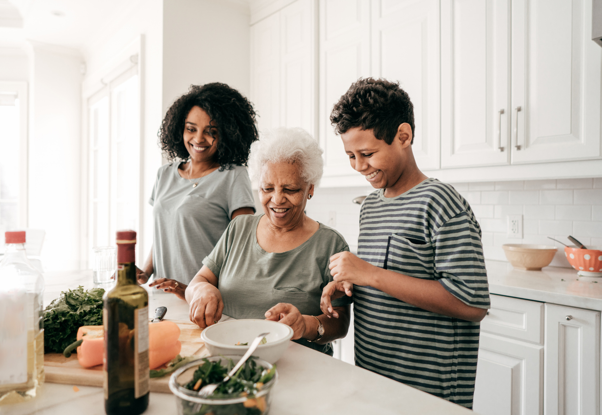 Grandmother teaching kids how to cook